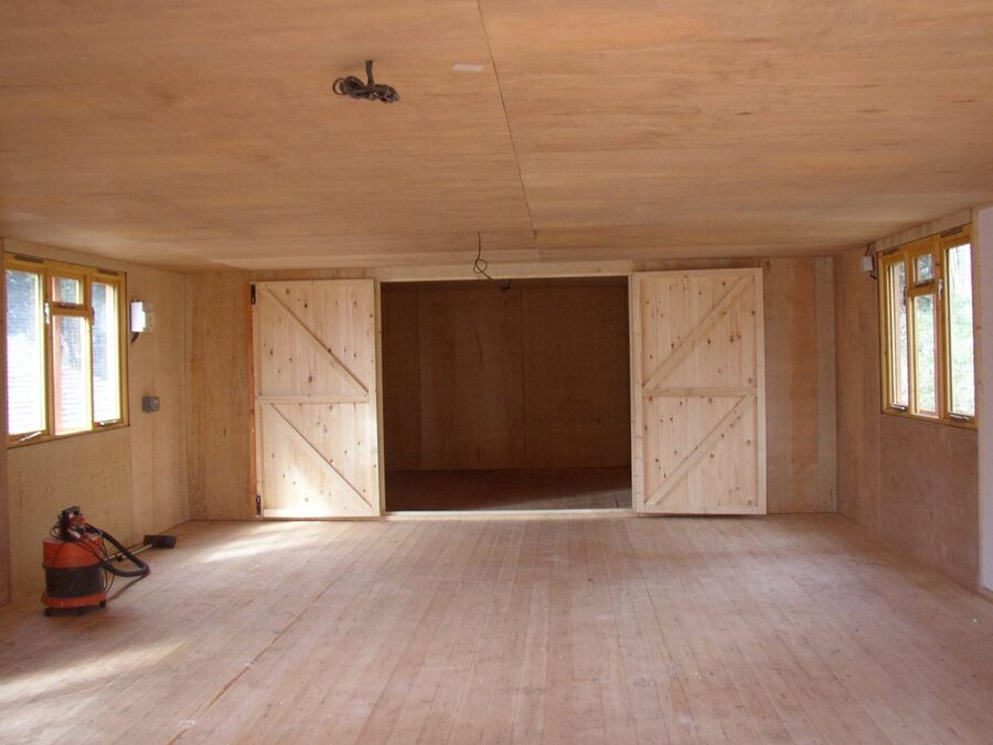 Inside a 30x18 timber storage building with double doors