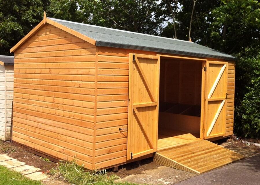 Timber workshop with open double doors and an access ramp