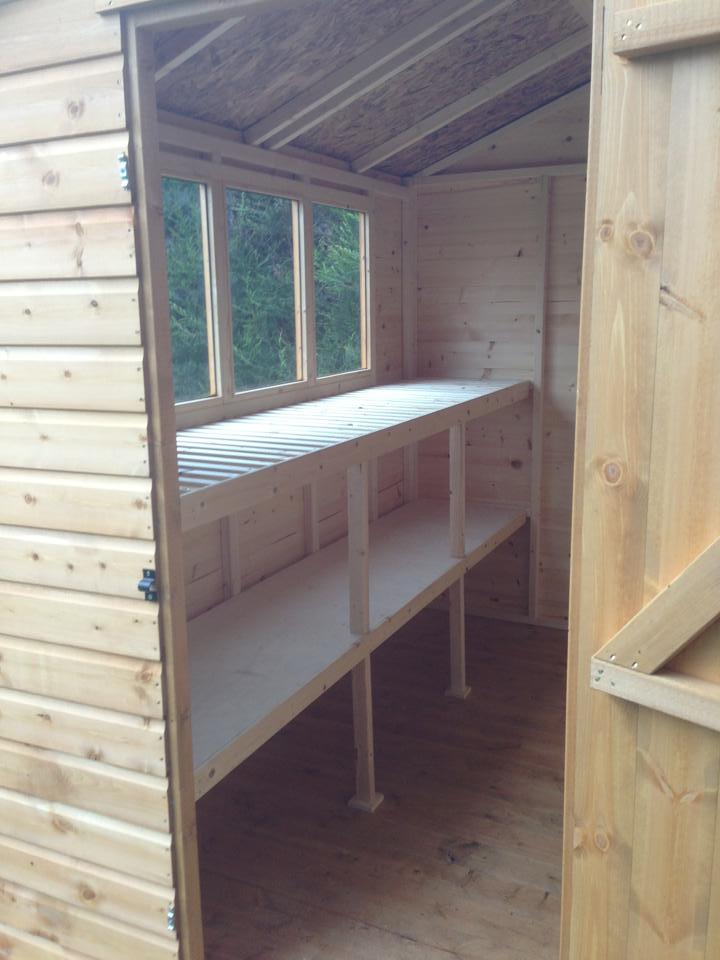Inside a Master Sheds potting shed, showing the bench under the window