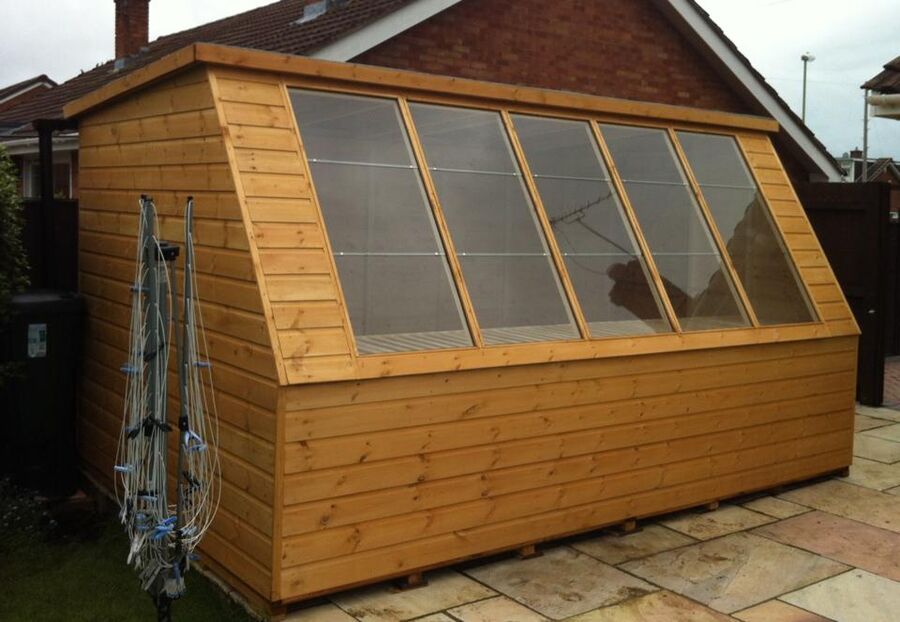 Large potting shed with a sloping glazed roof by Master Sheds